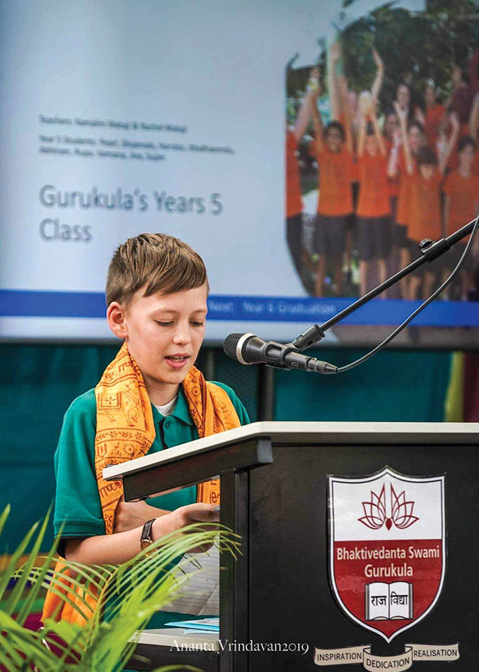 Toshan Krishna Rose giving an end-of-year address at the Bhaktivedanta Swami Gurukula at New Govardhana in 2019.